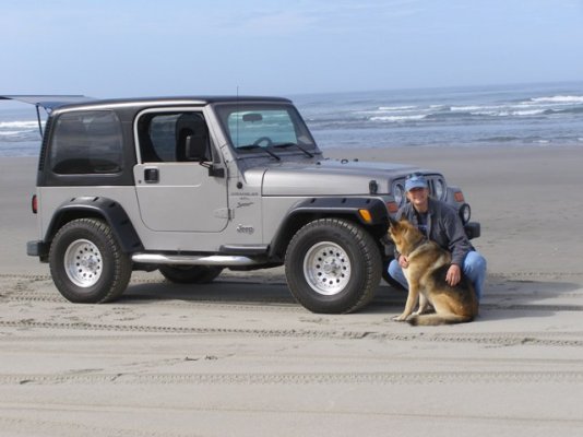 Di and Jeep on Fort Stevens beach 2001 TJ.jpg