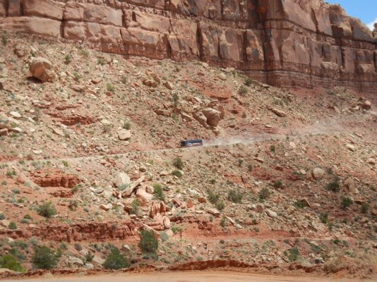 Tour bus descending Moki Dugway.JPG