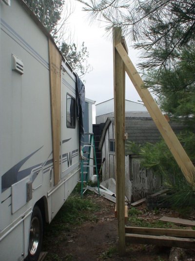 RV with board fitted & positioned by wall.JPG