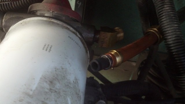 Plug the end of the fuel line with the cap.jpg