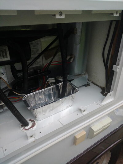 Dometic fridge drain pan and new tube.jpg