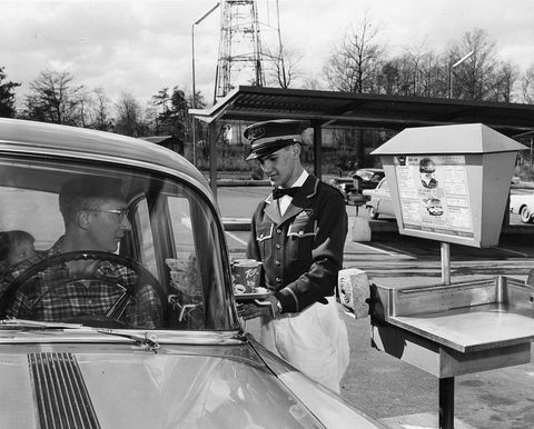 uniformed-carhop-serves-food-to-a-drive-in-customer-at-tops-news-photo-1635178985.jpg